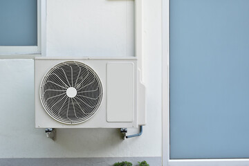 Exhaust fan hanging on house's wall in Asian countries.