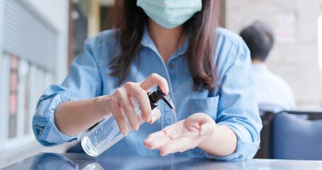 woman use hand sanitizer gel - obrazy, fototapety, plakaty