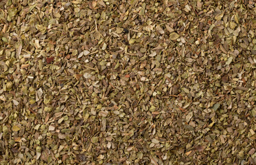 Top view, closeup of dried oregano. Food backdrop