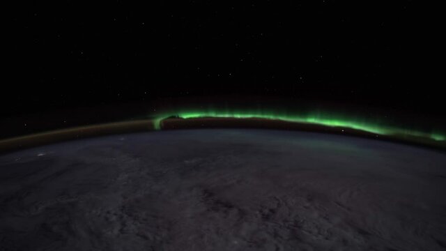 Polar Lights. NASA. The International Space Station.
Aurora Borealis & Cloudy Skies Over North America.
Source material was provided by NASA. Color correction was done, noise was removed and slowed do