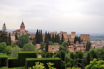 Naklejka premium Alhambra or Red Castle in Granada spanish city, located on top of hill al-Sabika. Moorish palace fortress complex in Andalusia, Spain