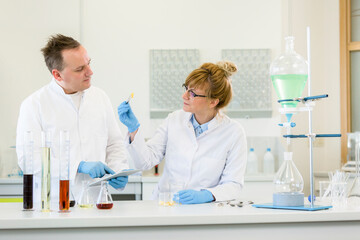 Two scientists working with terpene crystals in laboratory