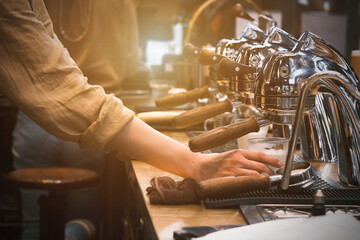 Espresso pouring from coffee machine. coffee machine preparing fresh coffee and pouring into red cups at restaurant, bar or pub. Brew coffee