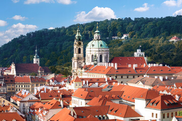 Fototapeta na wymiar Prague, St. Nicolas church and rooftops