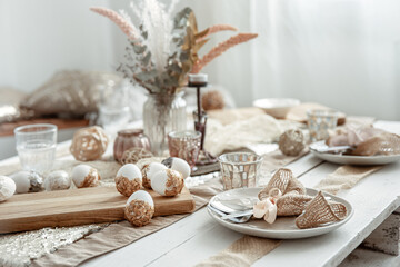 Table setting for Easter with many decor details.