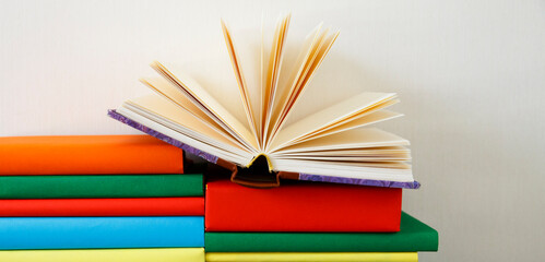 Opened Book on a pile of books