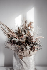 A bouquet of dried flowers as a detail of home interior design close up.