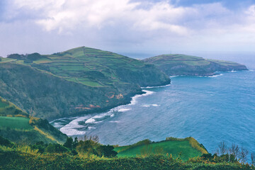 Fototapeta na wymiar Scenic sea view of Azores, Portugal with trees and beach..