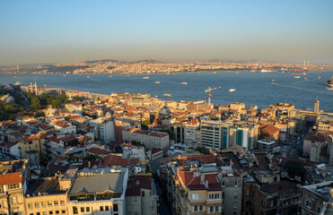 Fototapeta na wymiar Scenic view on sunset sky from Galata Tower over Bosphorus, Beyoglu and Besiktas districts, towards Bosporus Bridge in Istanbul, Turkey 