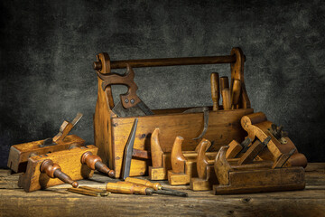 Fototapeta na wymiar Still life - Old Wooden Tool Box Full of Tools