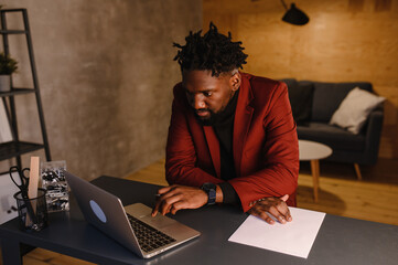 Handsome Black African American Man Working from Home and Having Video Call on Laptop Computer...