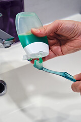 Toothbrush with green toothpaste tube