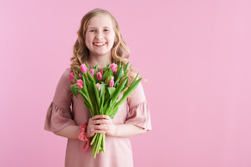 happy stylish girl in pink dress on pink