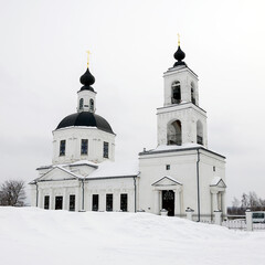 orthodox church made of white brick in winter