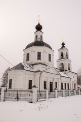 orthodox church made of white brick in winter