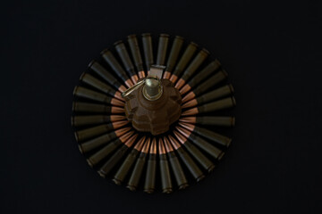 Fototapeta premium Grenade and cartridges for AKM 7.62x39 in the form of a circle on a black background