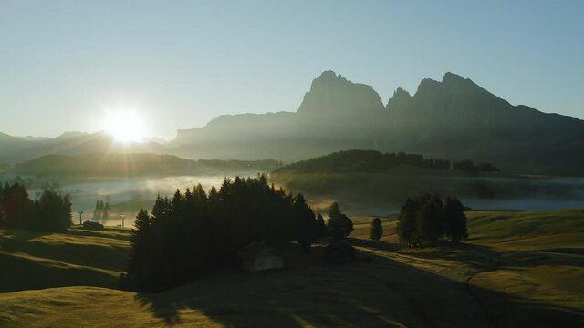 Alpe di Suisi, Dolomites. Aerial drone view of Alpine meadow mountain Plateau in Italy. Sunrise morning landcape scenary at idyllic Seiser Alm valley in South Tyrol. Europe