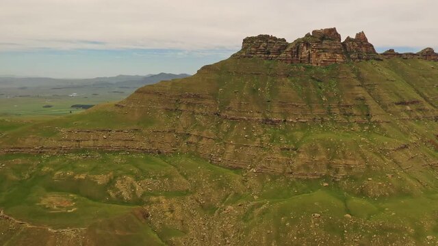 Rocky steep mountain slope amidst KwaZulu Natal Midlands, South Africa - Aerial slow slide shot