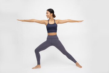 Obraz premium Asian woman doing yoga practices Ashtanga Vinyasa Yoga asana Virabhadrasana 2 or warrior pose 2 isolated on white background