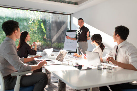 Business people having meeting in board room
