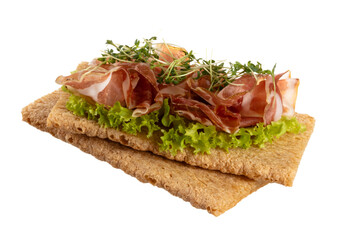 Variety of mini sandwiches with cream cheese, vegetables and salami.