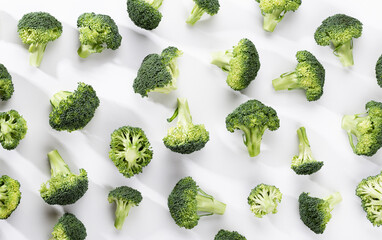 Fresh tasty broccoli on white background, top view.
