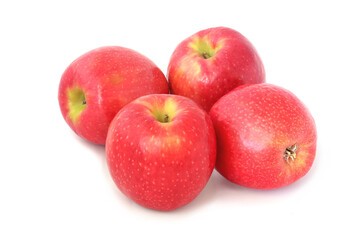 Four ripe red apples isolated on white