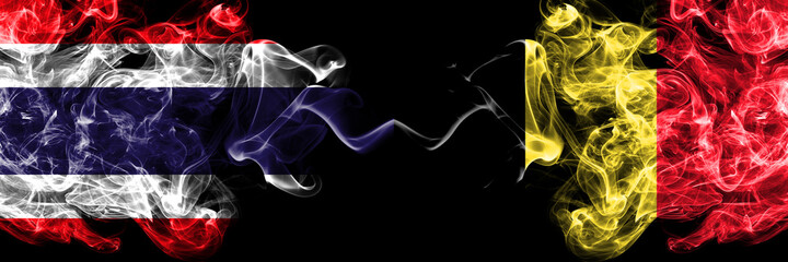 Thailand, Thai vs Belgium, Belgian smoky mystic flags placed side by side. Thick colored silky abstract smokes flags.