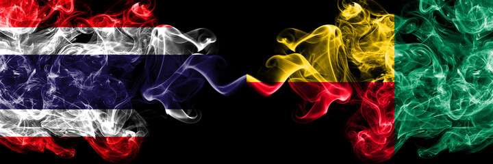 Thailand, Thai vs Benin, Beninese smoky mystic flags placed side by side. Thick colored silky abstract smokes flags.