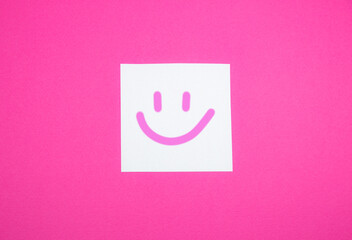 Smile on the white To Do List Sticker. Close up of reminder note paper on the pink background. Copy space. Minimalism, original and creative photo. Positive thinking. All be alright.