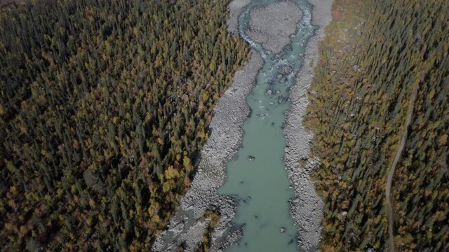 Aerial footage of a beautiful glacier river on a sunny day. Captured in 4k.