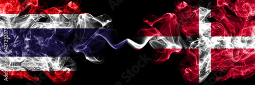 Thailand, Thai vs Denmark, Danish smoky mystic flags placed side by side. Thick colored silky abstract smokes flags.