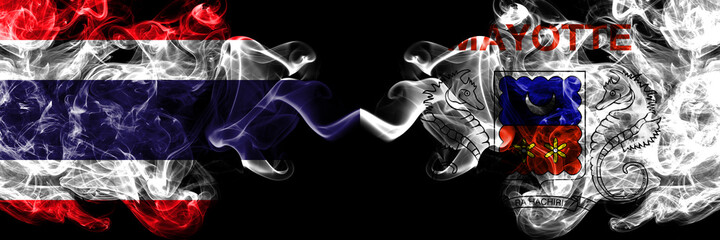 Thailand, Thai vs France, French, Mayotte smoky mystic flags placed side by side. Thick colored silky abstract smokes flags.