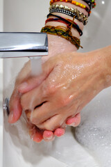 Fototapeta premium Wash hands by rubbing with soap for prevention of corona virus, hygiene to stop spreading coronavirus.