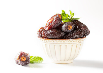 Dates fruit and rosary still life against on white background. Ramadan background greeting card. Ramadan Kareem.