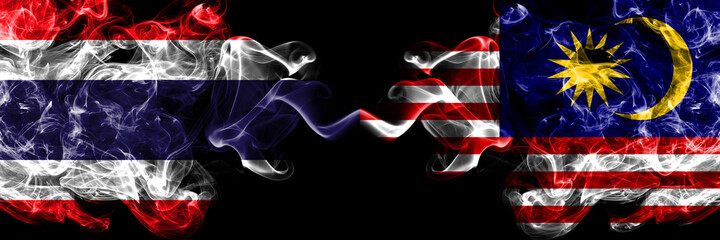 Thailand, Thai vs Malaysia, Malaysian smoky mystic flags placed side by side. Thick colored silky...