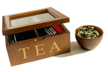 Wooden container for storing tea bags and a bowl with dried mint.