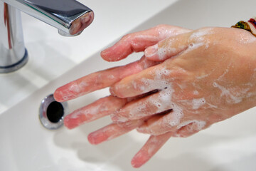 Wash hands by rubbing with soap for prevention of corona virus, hygiene to stop spreading coronavirus.