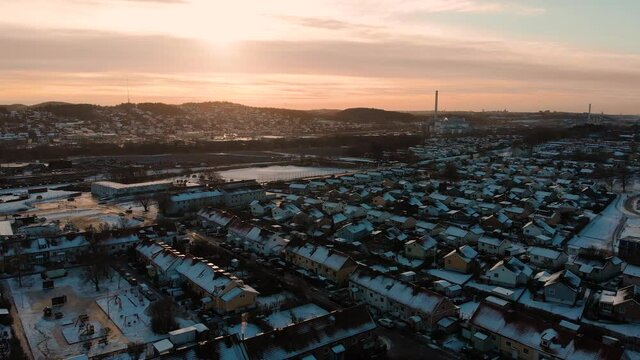 Aerial - Sunrise over Utby, suburb of Gothenburg, Sweden, wide backward shot