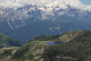 Alpine summer landscape. View on the rocks and on the Nero lake with the background of the Brenta Dolomites, one of the most famous places of pure beauty in Trentino, Val Nambrone, Pinzolo, Italy.