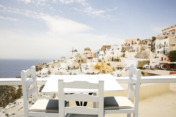 Fototapeta na wymiar White table and chairs in Greece 
