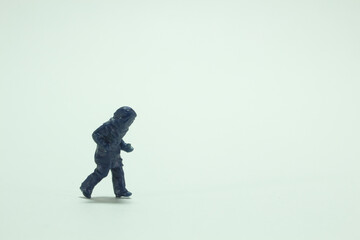Minifigure of a running person in bomb suit/miniature people