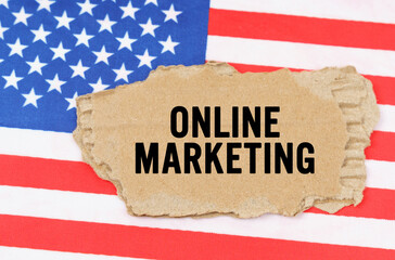On the US flag lies a cardboard box with the inscription- ONLINE MARKETING