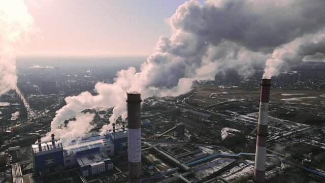 Factory emissions of smoke from factory pipes in indistrial zone. Industrial factory pollution of carbone gases of ecology.