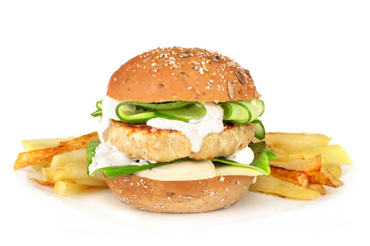 Fishburger with french fries on white