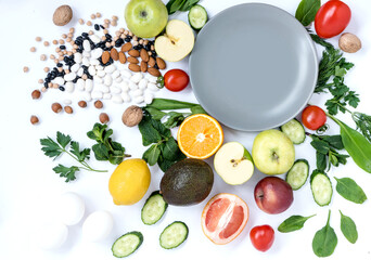Flat lay composition of fresh food with empty plate for healthy food and diet. Foods isolated background
