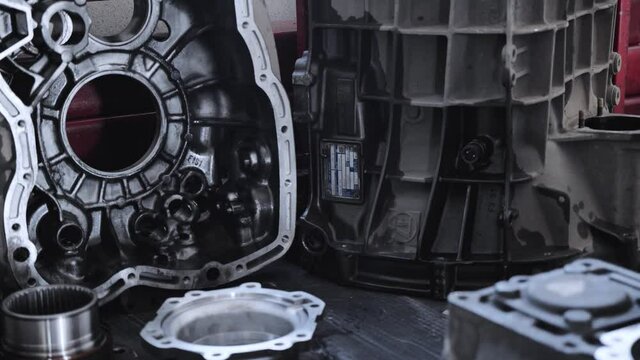 Close-up of gearbox parts in a truck service station. Annual maintenance
