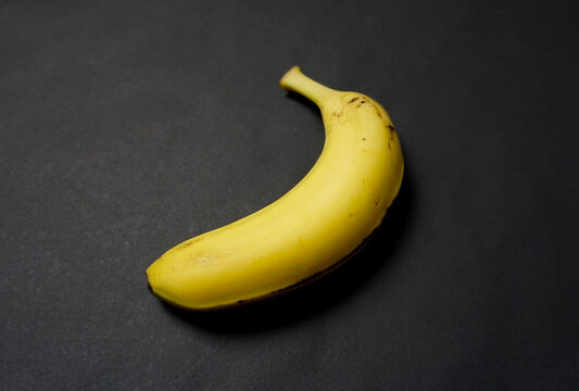 Fresh banana on black background.