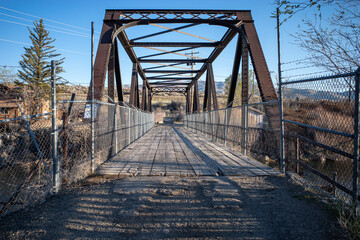 Perspective view of vintage bridge over the river in the desert near Reno, Nevada