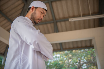 Asian islam man prayer,Young Muslim praying,Ramadan festival concept